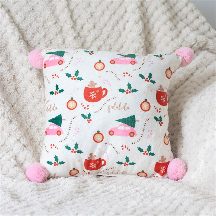 Square Sugarplum Fun Christmas Print Cushion with pink pom poms, featuring festive icons for a vibrant holiday home.
