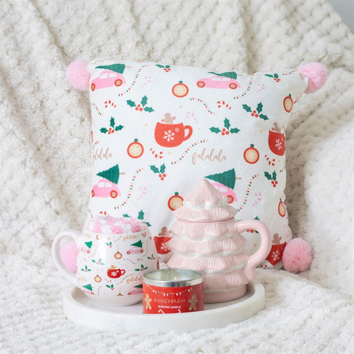 Square Sugarplum Fun Christmas Print Cushion with festive motifs and pink pom poms, perfect for a joyful holiday home.