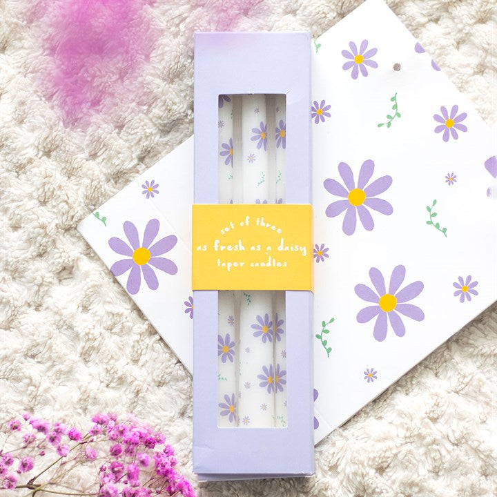 Set of 3 Purple Daisy Taper Candles - Unscented, perfect for spring decor and enhancing table settings.