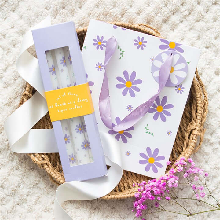 Set of 3 Purple Daisy Taper Candles - Unscented, perfect for spring decor and enhancing your table setting.