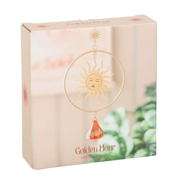 Golden Hour Crystal Suncatcher with elegant sun design and vibrant orange crystal, perfect for brightening any space.