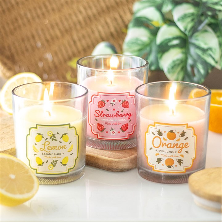 Experience the sweetness of the Strawberry Scented Candle, beautifully designed with floral accents and a matching box.