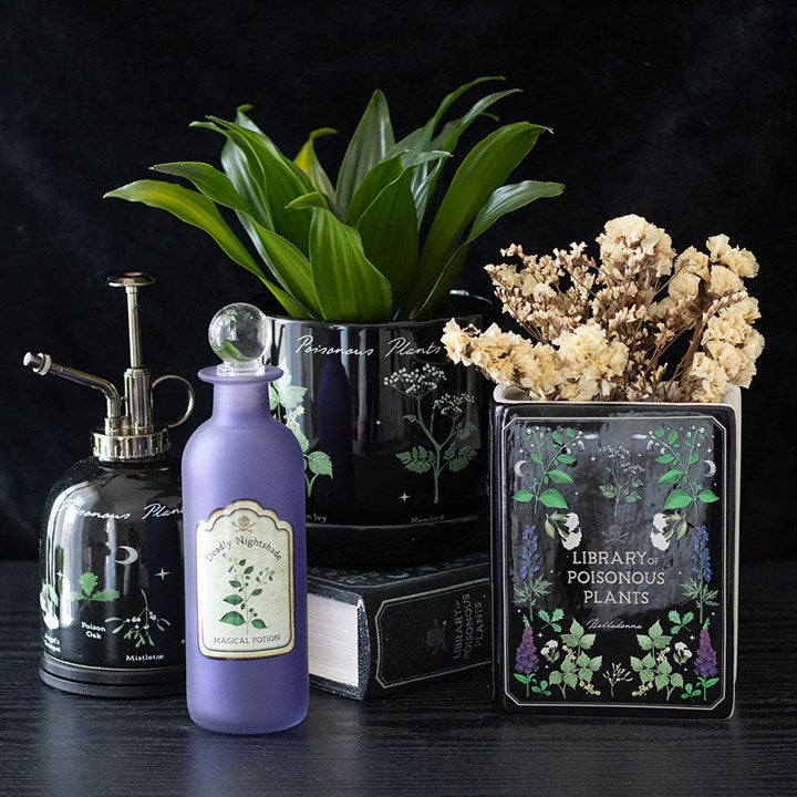 Dark elegance meets functionality with the Poisonous Plants Book Shaped Vase, perfect for floral displays or decor.