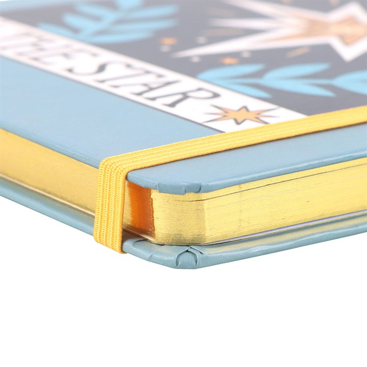 Blue The Star Vintage Tarot A5 notebook with gold-edged pages and a yellow elastic band.
