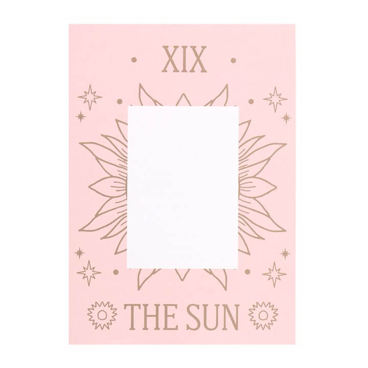 Gold-toned pendant necklace featuring The Sun Tarot Card on a pink illustrated greeting card.