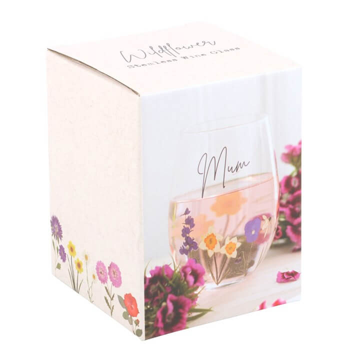 Mum Wildflower Stemless Glass with vibrant floral designs, perfect for enjoying drinks in the summer garden.