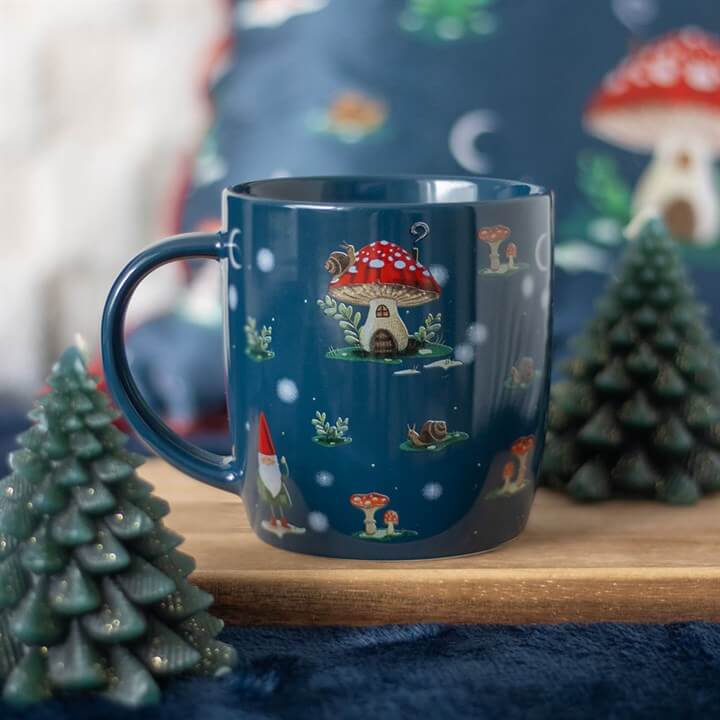 Navy Gnome Sweet Gnome Print Mug showcases whimsical gnomes and mushroom houses, perfect for a magical morning.