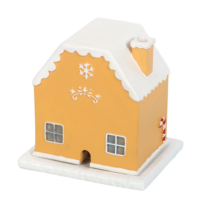 Candy Cane Gingerbread House Incense Cone Holder adds festive charm, releasing fragrant smoke from its chimney.