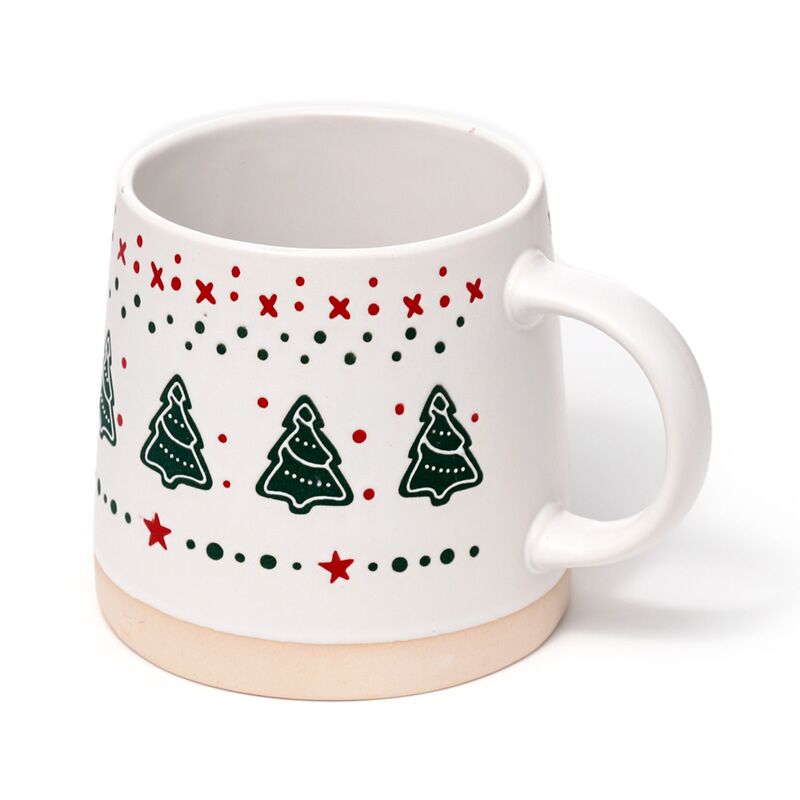Stoneware mug with Christmas tree design, featuring green trees, red stars and red dots on white with a beige base.