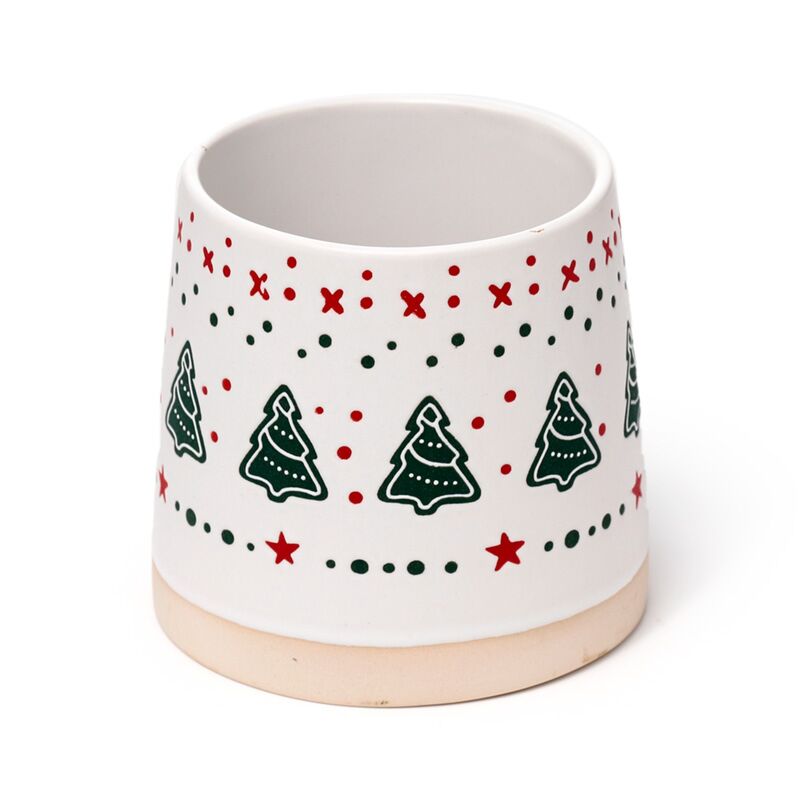Stoneware mug with white glaze featuring Christmas tree motifs and red and green dotted border, tan base.