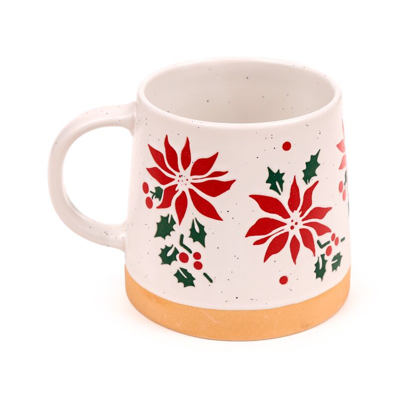 Stoneware mug featuring red poinsettia, green holly leaves, white speckled glaze and a natural tan base.