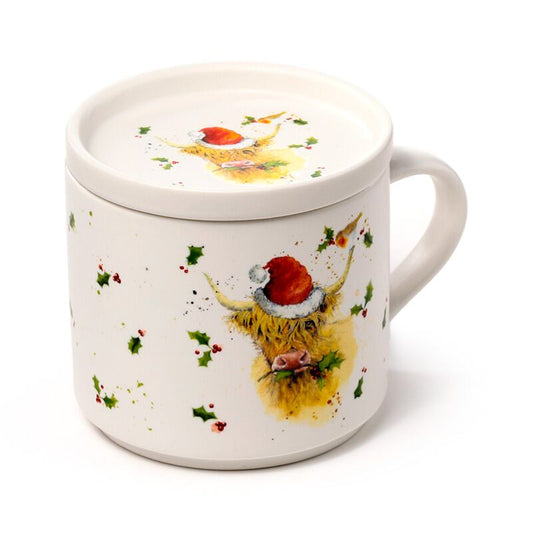 Porcelain mug with lid featuring a Highland Coo in a Santa hat and holly for Christmas.