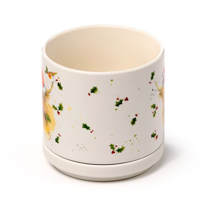 Porcelain mug with Christmas Jan Pashley Highland Coo design and holly accents, part of a coaster lid set.