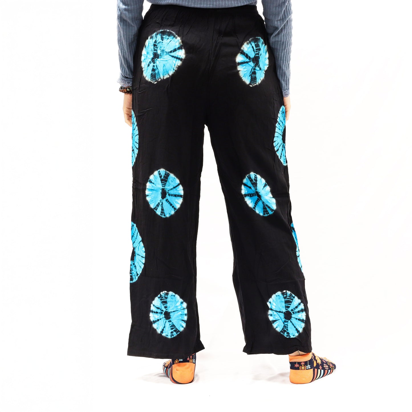 Black Japanese-style tie-dye lounge trousers, large, blue circular patterns on linen-rayon blend.