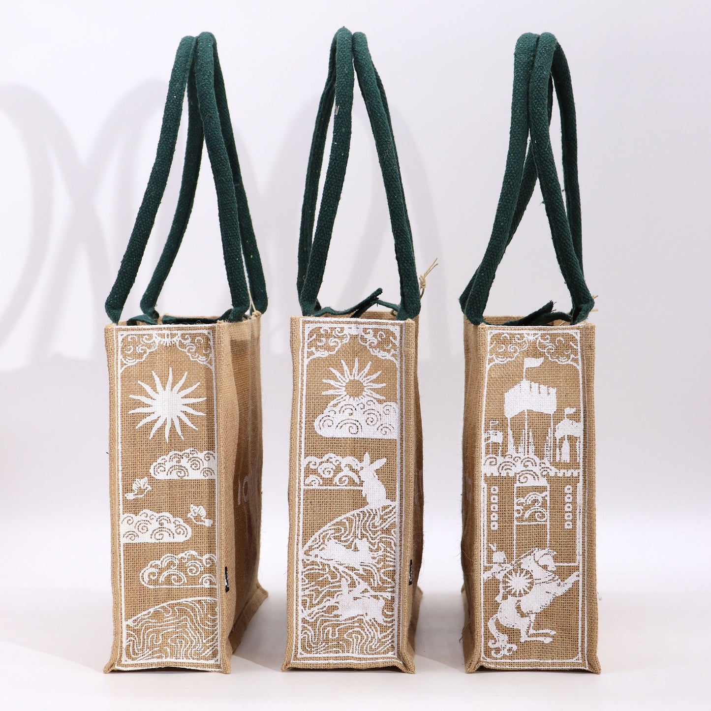 Hop Hare Jute Big Bag - I am Magical, three jute tote bags with green handles and white mystical hare, sun and castle prints