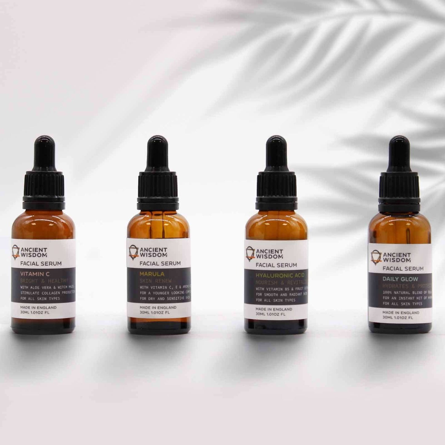 Ancient Wisdom Marula Oil Serum bottles lined up; UK-made facial serum for dry, sensitive skin with vitamins C & E.