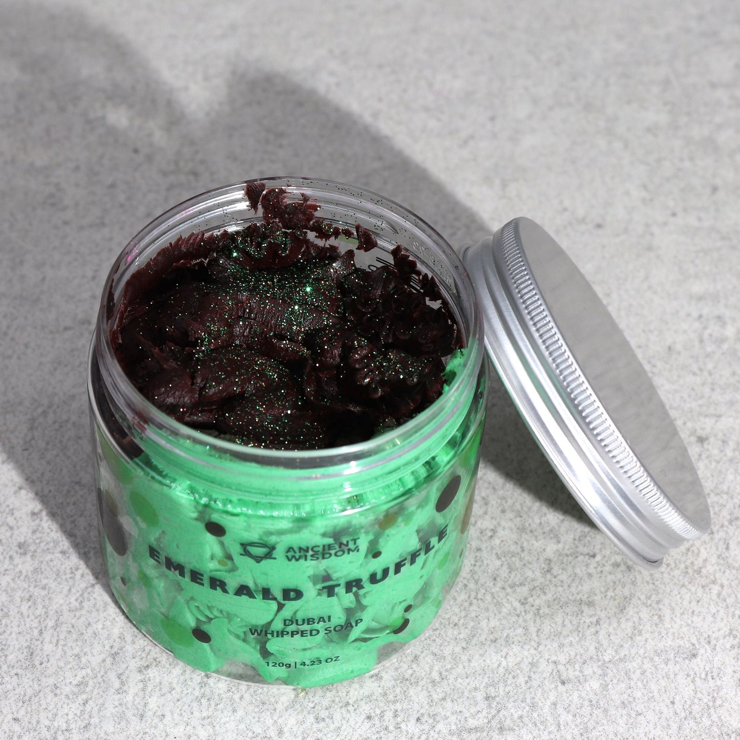 Emerald Truffle Dubai Whipped Soap in a green jar with burgundy topping, 120g