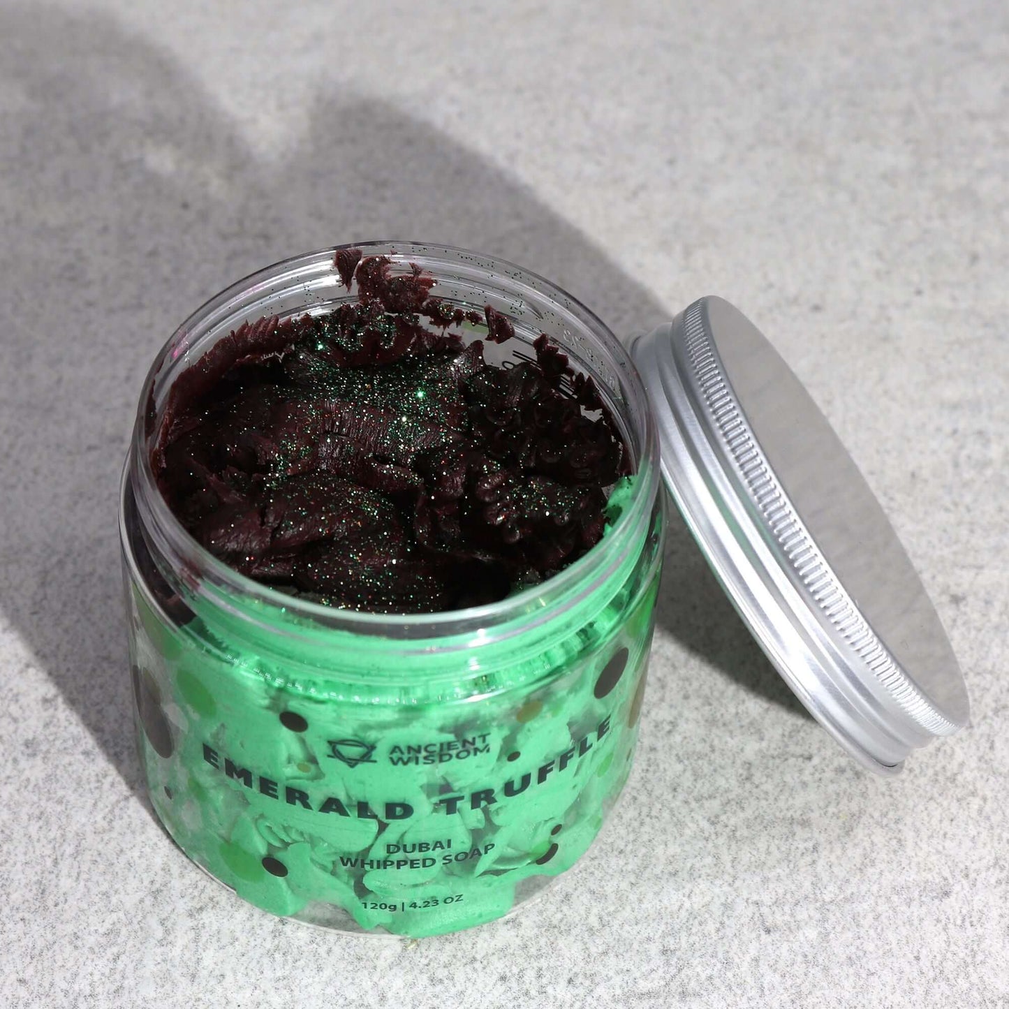 Emerald Truffle Dubai Whipped Soap in a green jar with burgundy topping, 120g
