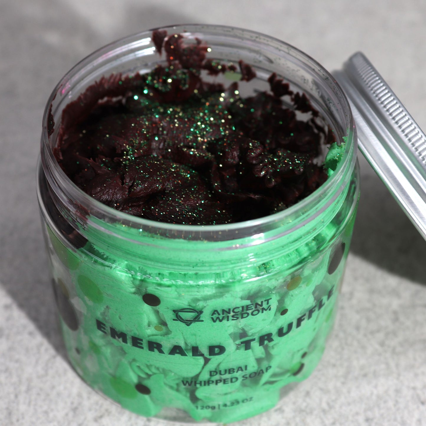 Dubai Whipped Cream Soap – Emerald Truffle 120g in a clear jar with green whipped soap and burgundy glitter