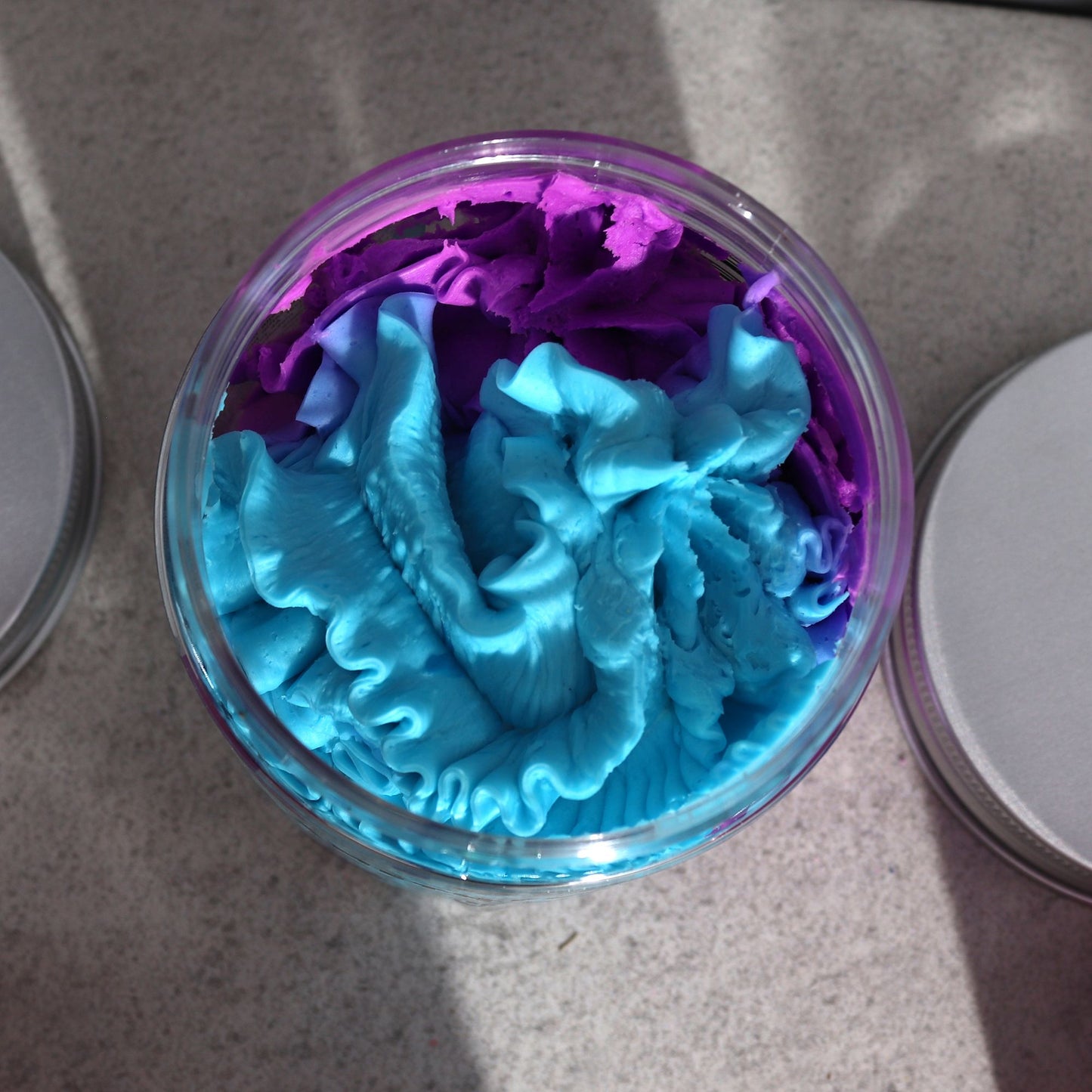 Amethyst Creed Whipped Cream Soap 120g with blue and purple swirls in a clear jar.