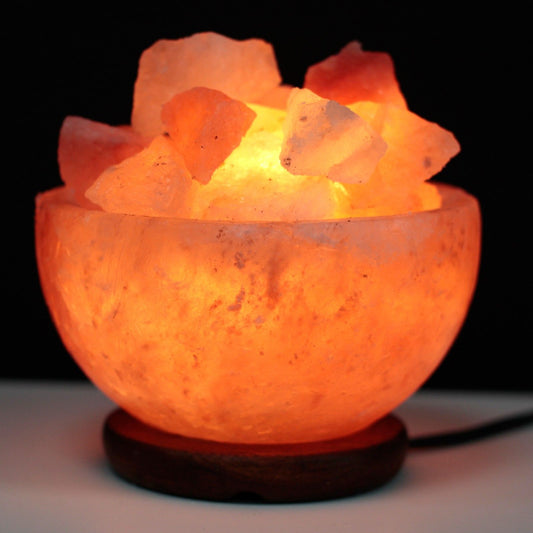 Salt Fire Bowl and Chunks, 15cm x 9cm, glowing Himalayan salt lamp with salt chunks on a wooden base