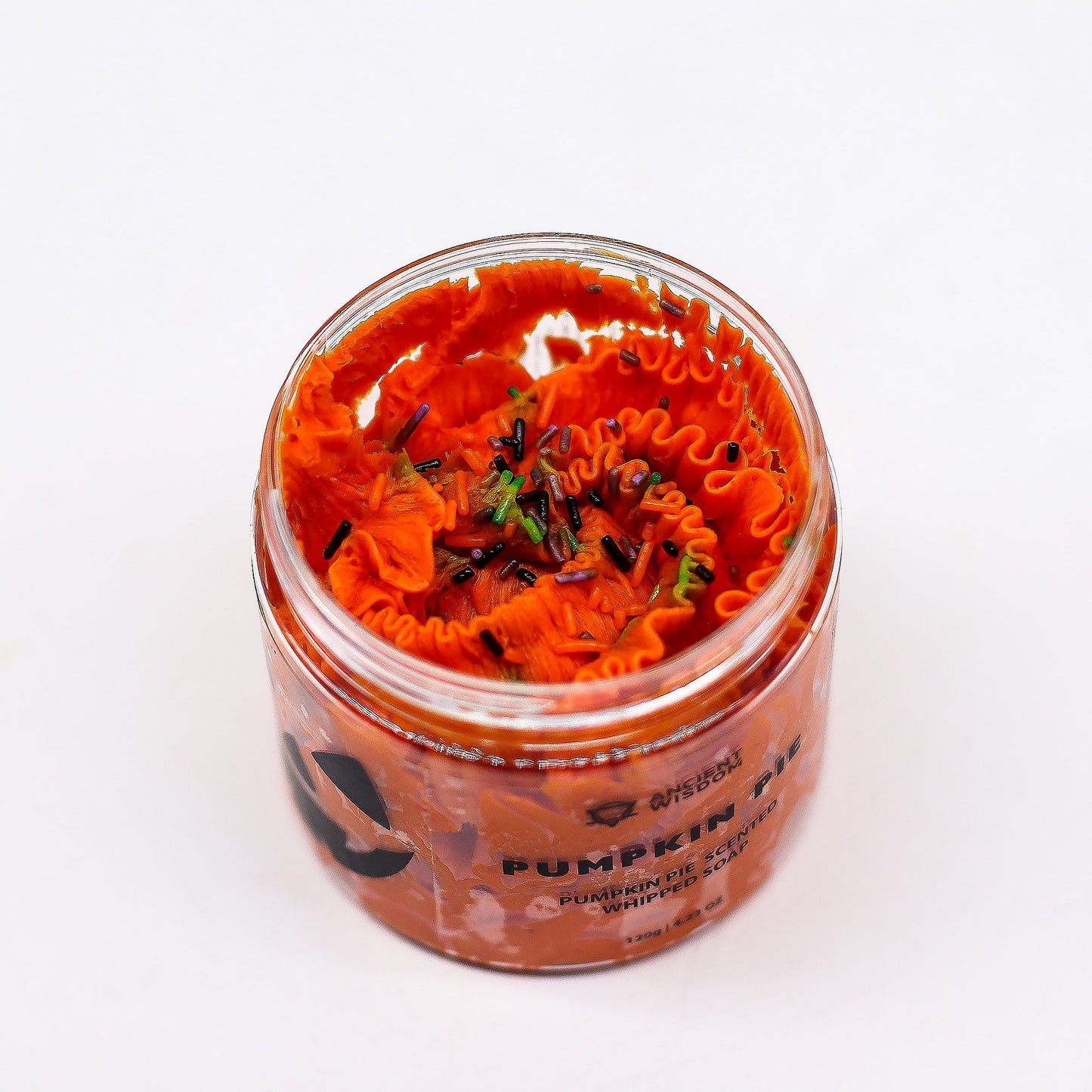 Pumpkin Pie Whipped Soap 120g in a jar, bright orange whipped soap with black and green sprinkles.