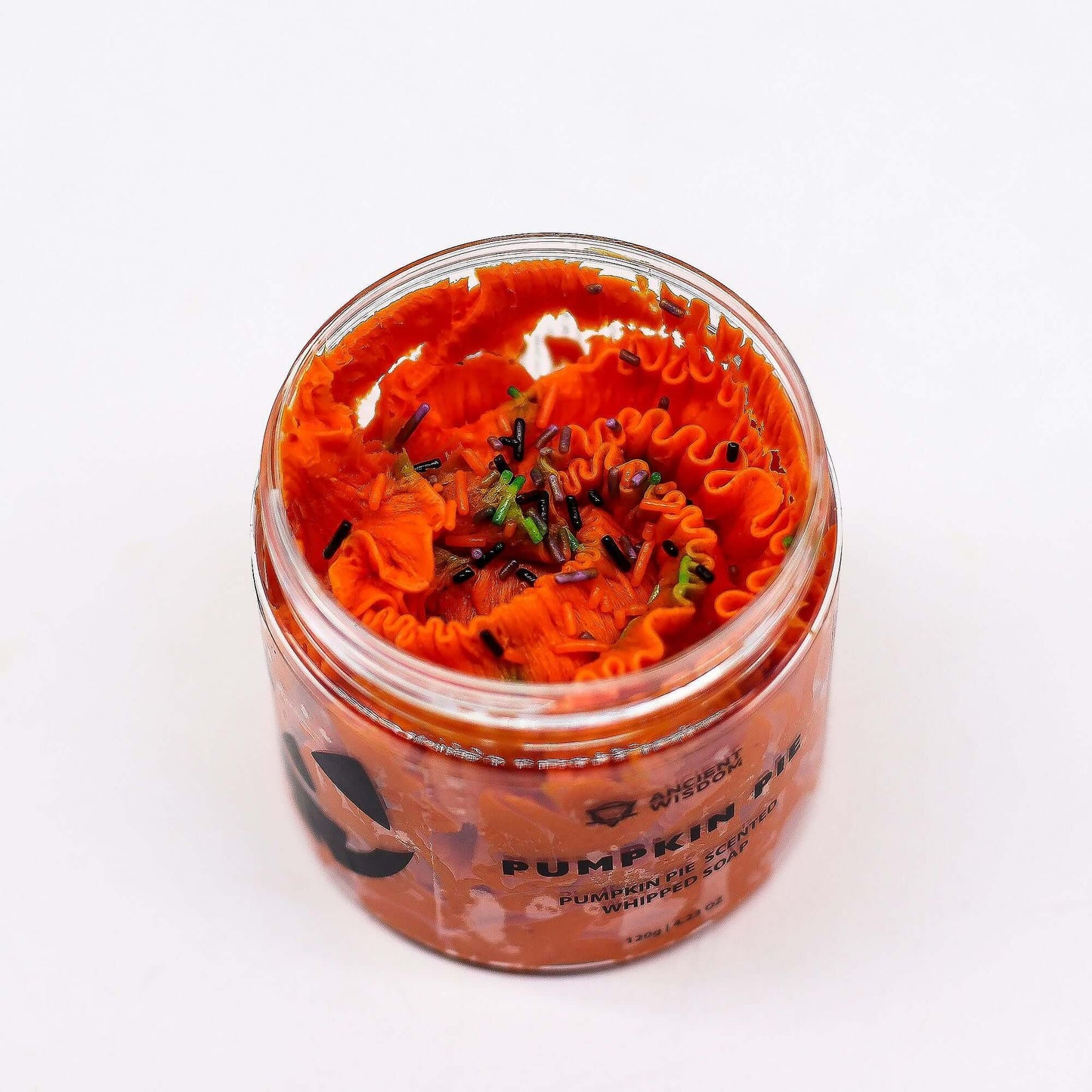 Pumpkin Pie Whipped Soap 120g in a jar, bright orange whipped soap with black and green sprinkles.