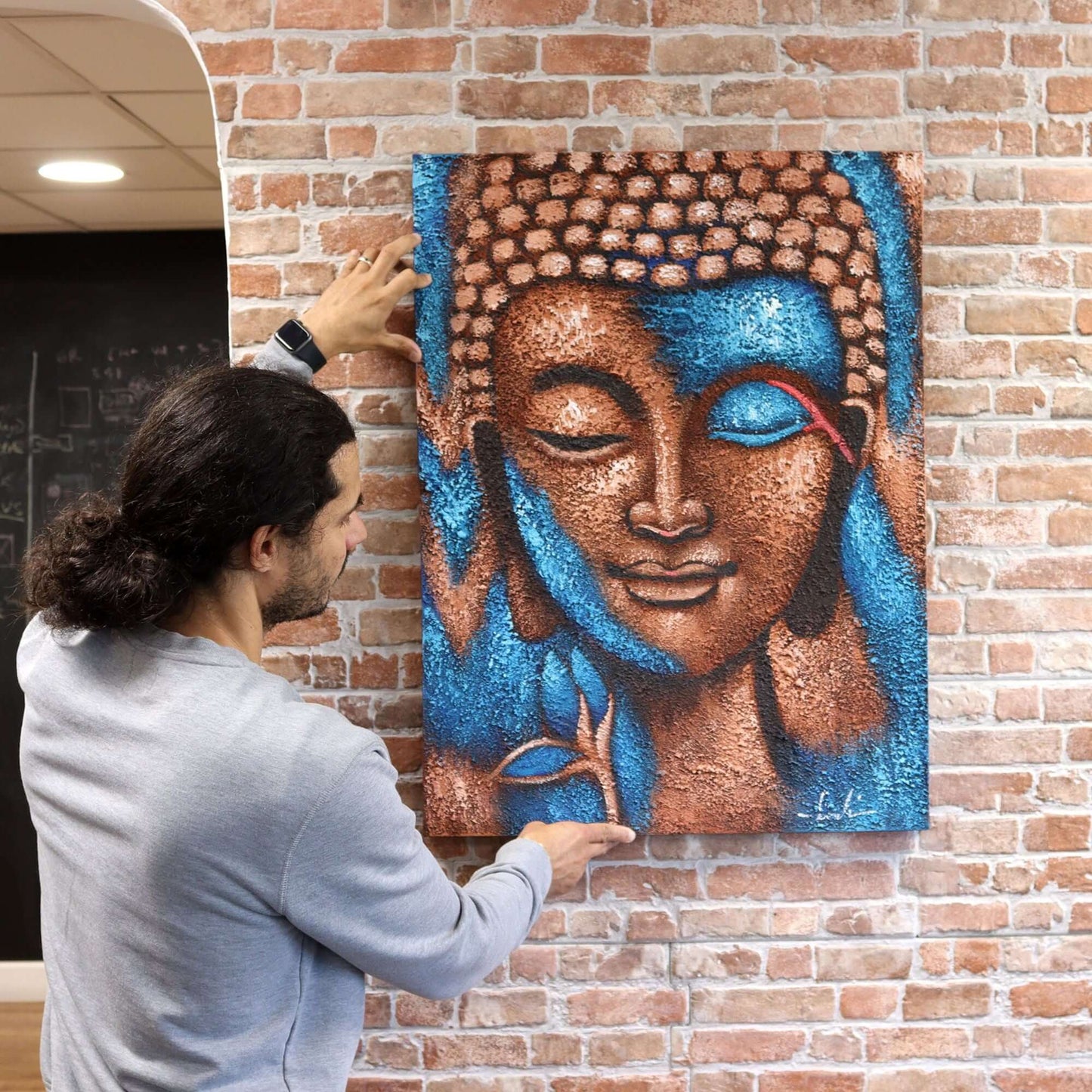 Buddha Painting - Blue on brick wall; blue & gold flower 75x55cm, serene Buddha artwork for your space.