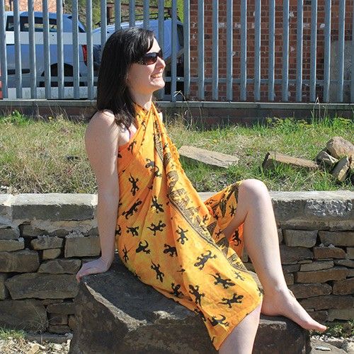 Lightweight Bali Gecko Sarongs - Yellow, featuring a vibrant gecko pattern and elegant border for summer style.
