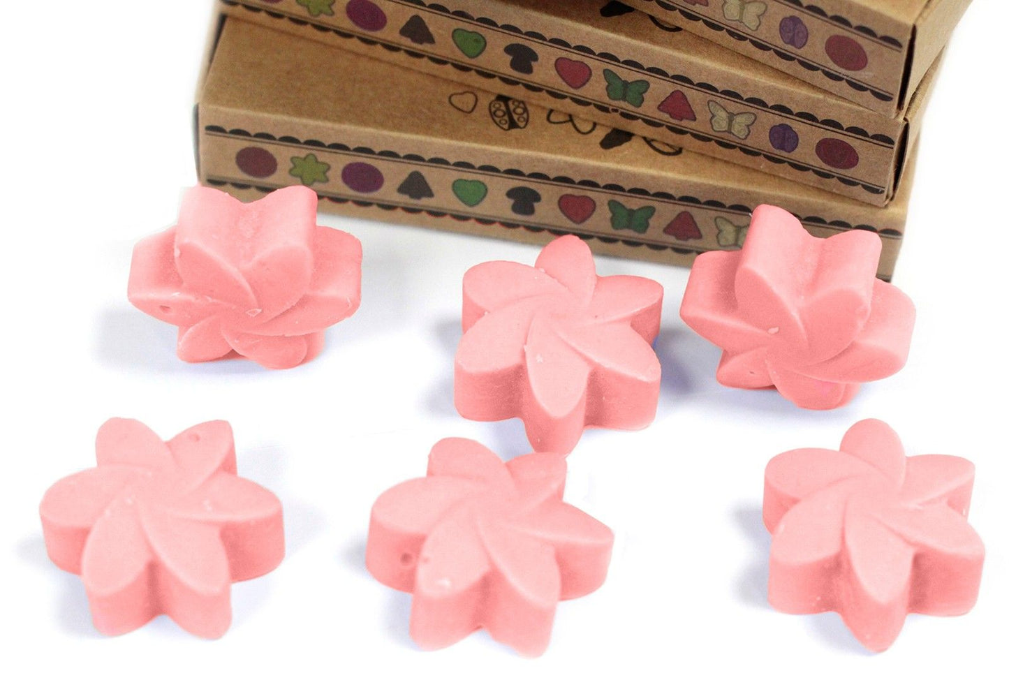 Six pink flower-shaped wax melts in matchbox-style packaging, Japanese Magnolia scent.