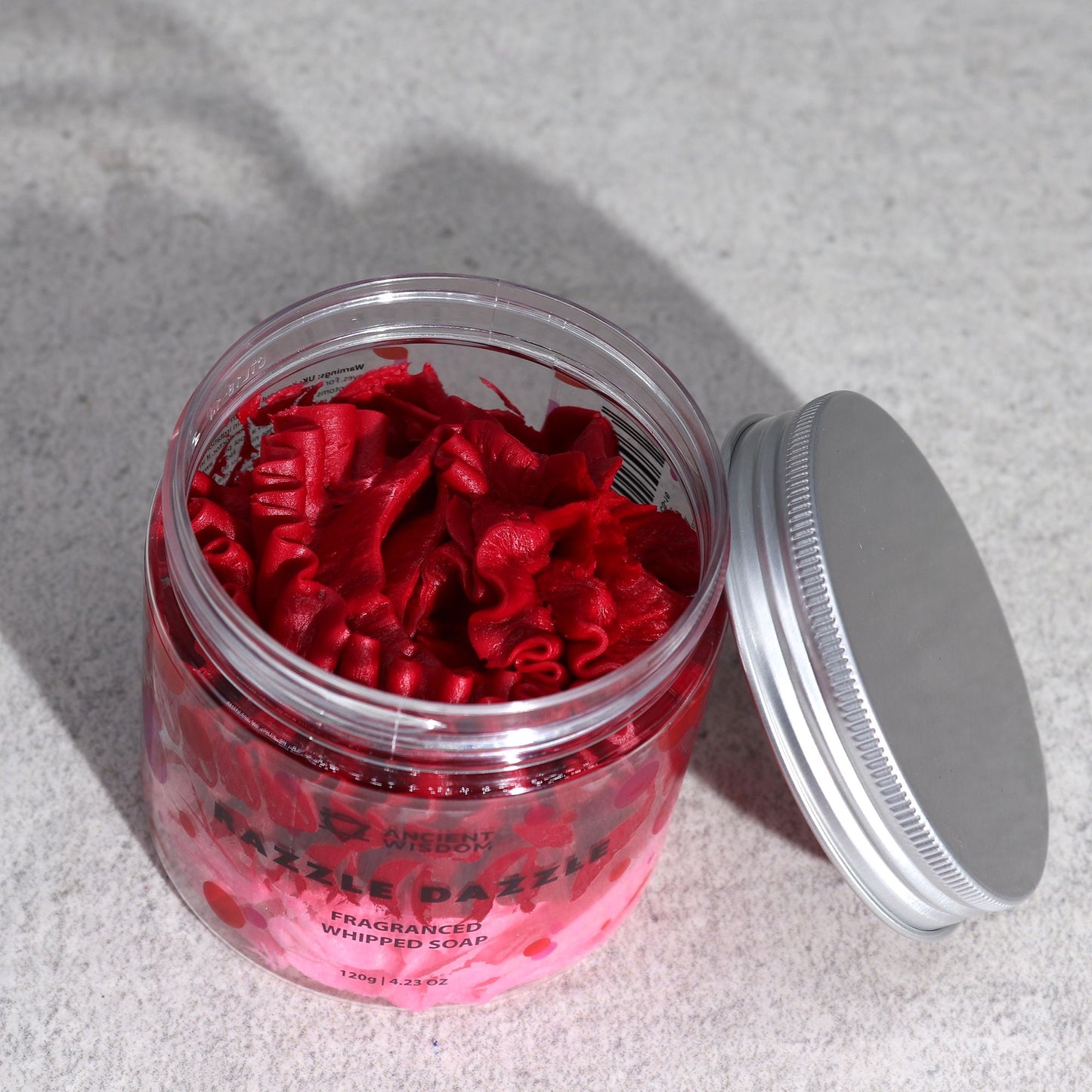Razzle Dazzle Whipped Cream Soap 120g in a clear jar; raspberry-red, ruffled whipped soap.