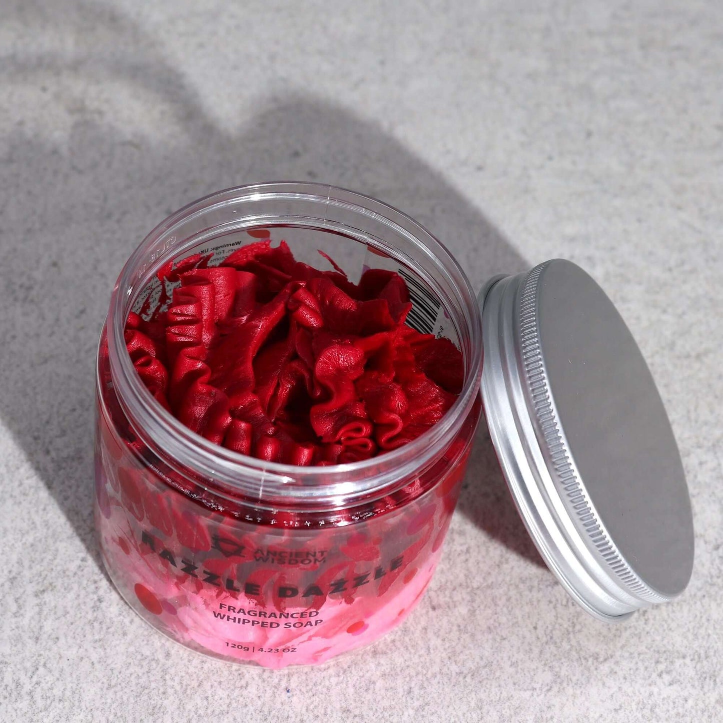 Razzle Dazzle Whipped Cream Soap 120g in a clear jar; raspberry-red, ruffled whipped soap.
