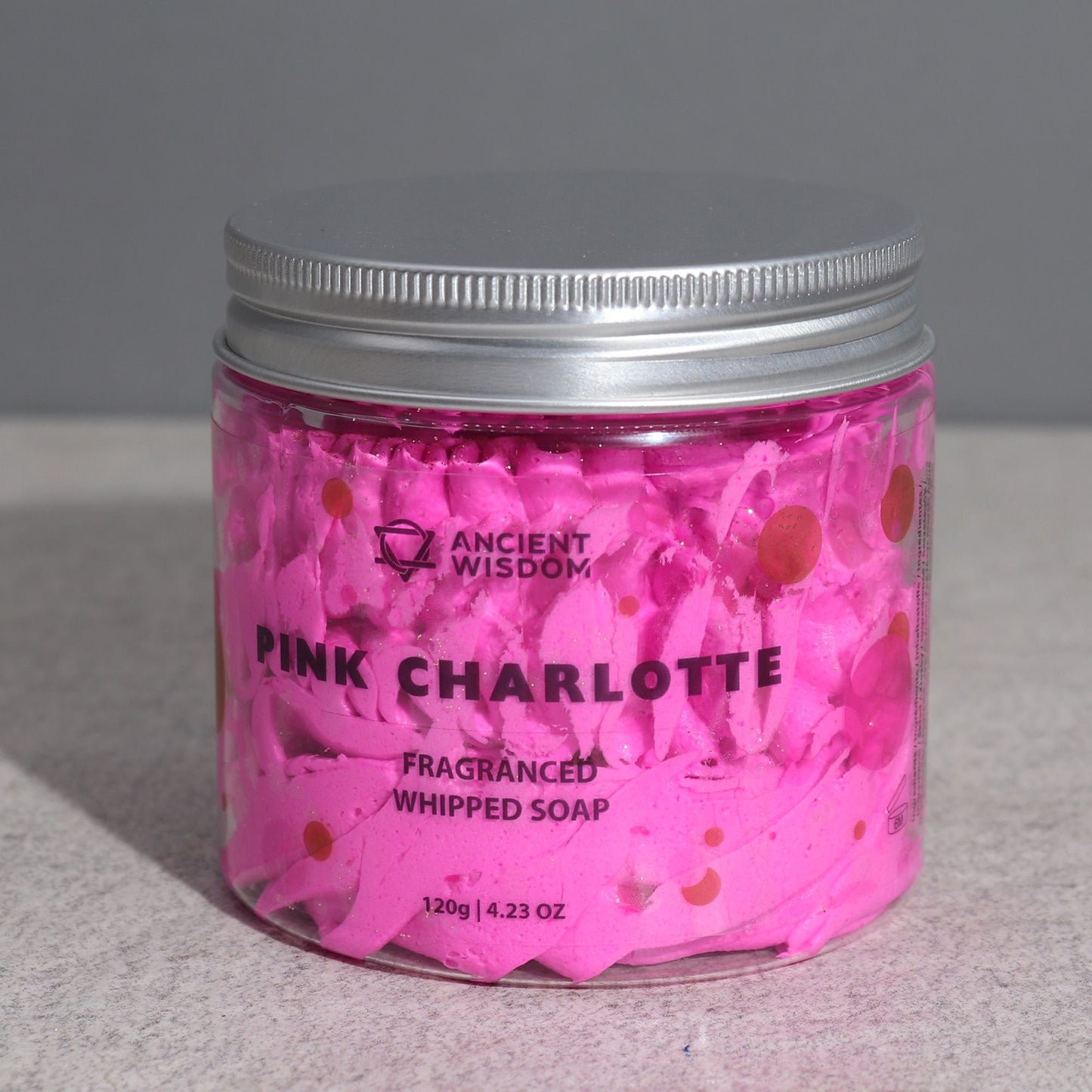 Pink Charlotte Whipped Cream Soap 120g in a clear jar by Ancient Wisdom, pink whipped soap with petals.