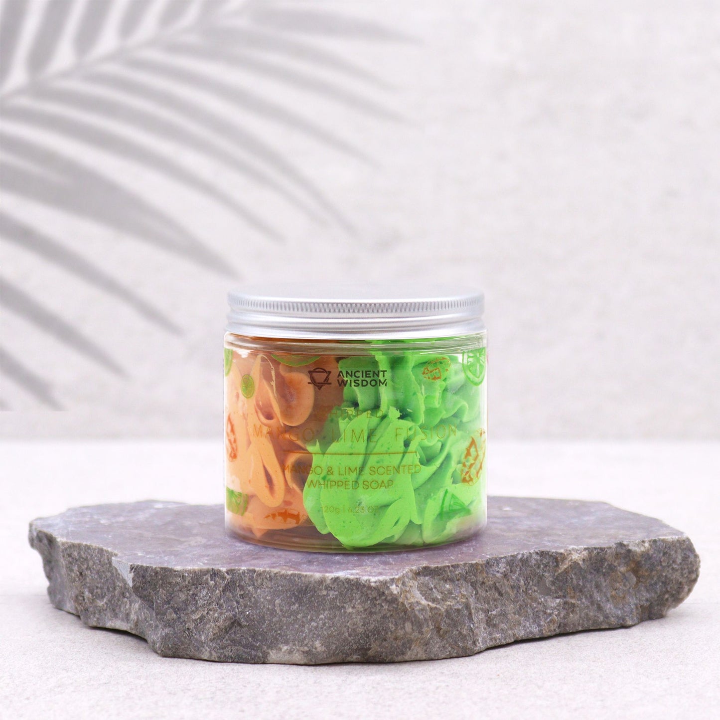 Mango & Lime Whipped Soap 120g jar with orange and green whipped soap on a stone slab