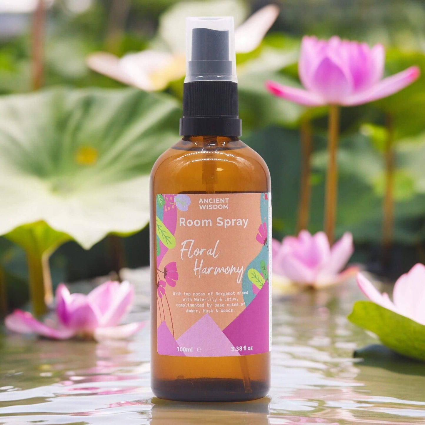 Summer Room Spray - Floral Harmony 100ml by Ancient Wisdom amber spray bottle on pond with lotus flowers