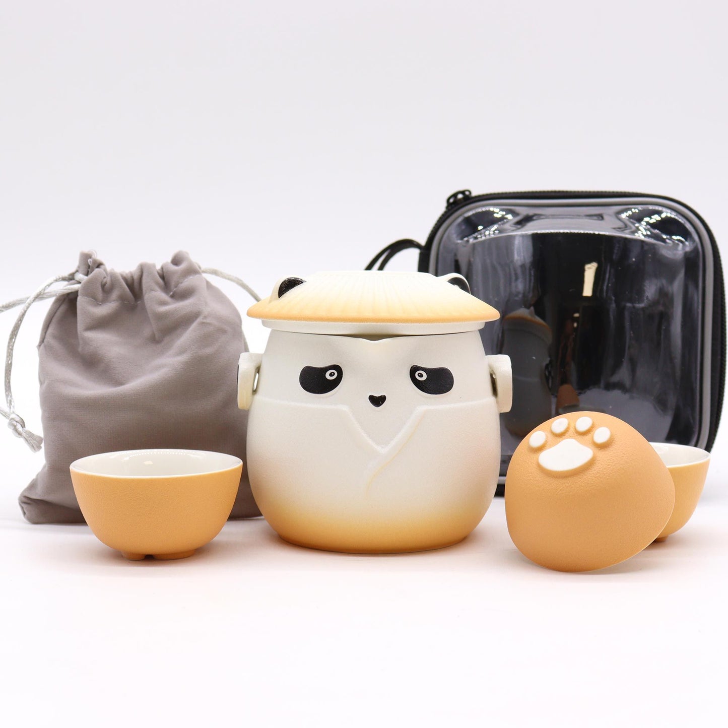 Panda Teapot Set with three orange cups and a panda-themed teapot.