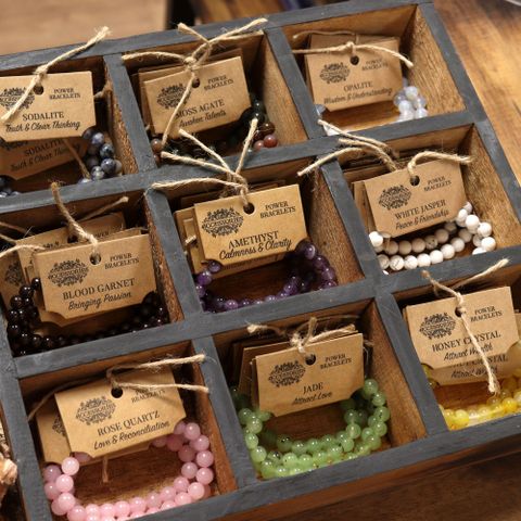 Stylish Power Bracelet - Green Jasper displayed in a wooden tray, perfect for enhancing any outfit at your store.