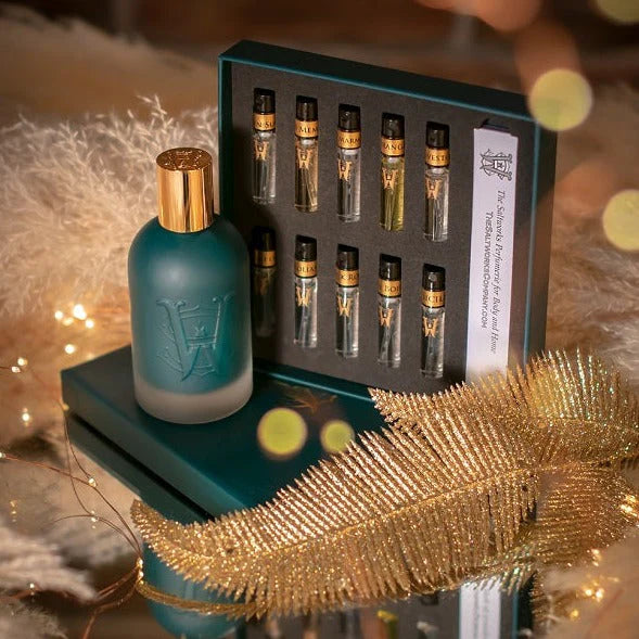 Discovery Set from Saltworks: ten 2ml fragrance vials in a display box beside a teal bottle.