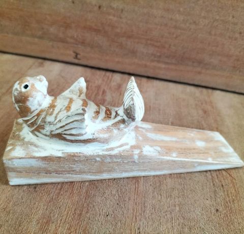 Hand carved Doorstop - Baby Seal, crafted from sustainable Jemipinis wood, adds charm and functionality to any space.