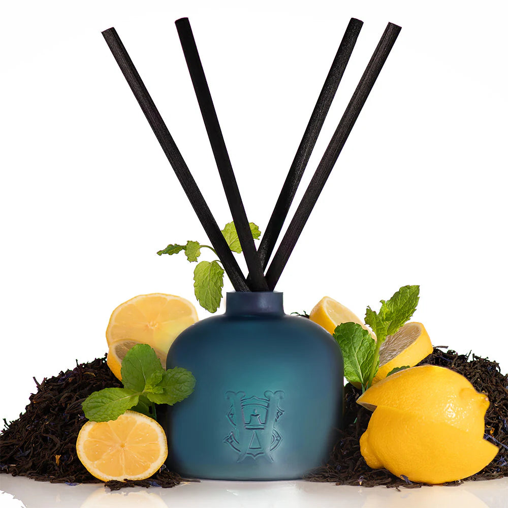 Evening Earl Grey Saltworks reed diffuser in teal bottle with black reeds, lemon and mint.