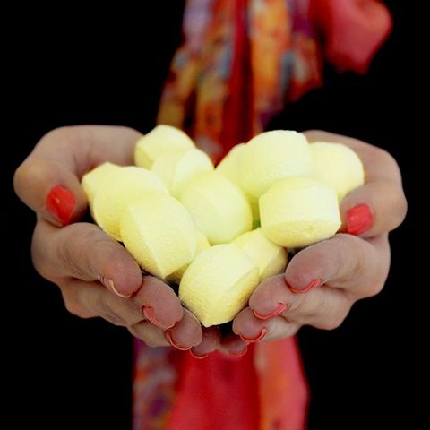 Delightful 1.3Kg Box of Chill Pills (Mini Bath Bombs) - Pinacolada in a person's hands, perfect for gifts and relaxation.