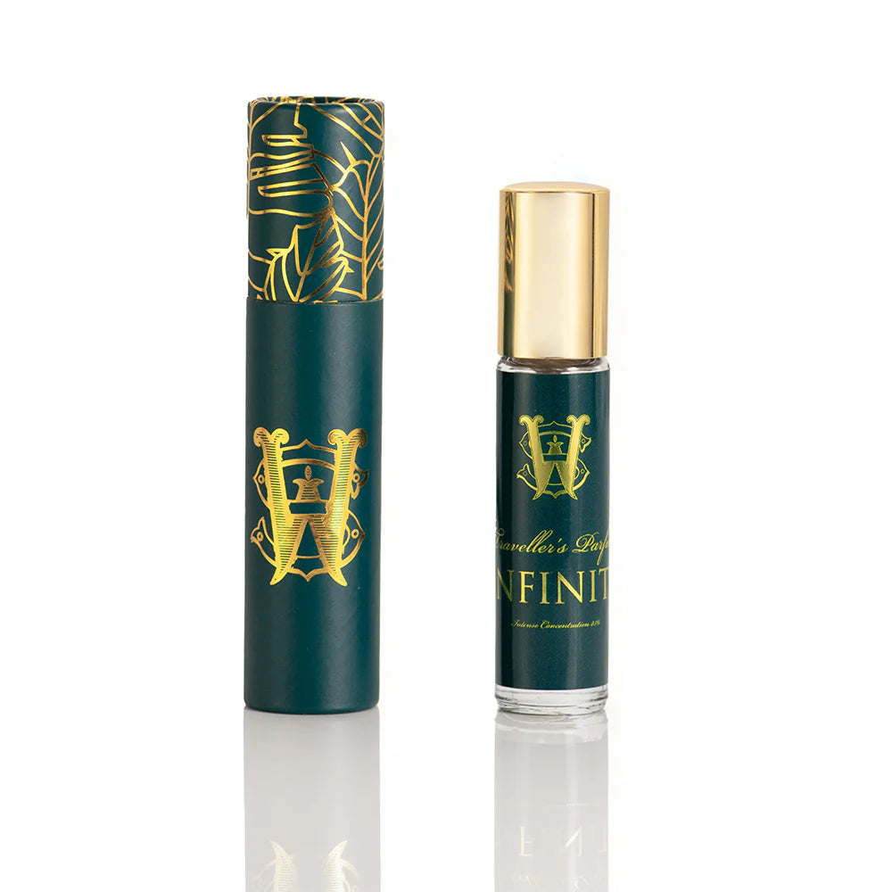 Infinity Saltworks fragrance green roller bottle with gold cap, showcasing a citrus-woody unisex scent.