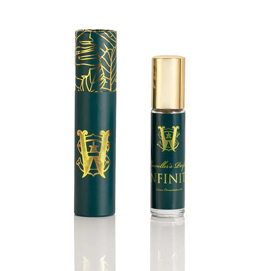 Infinity Saltworks fragrance green roller bottle with gold cap, showcasing a citrus-woody unisex scent.