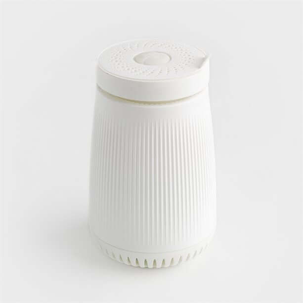 Avon Pure Aroma Diffuser with sleek white design, combining air purification and aromatherapy for fresher spaces.