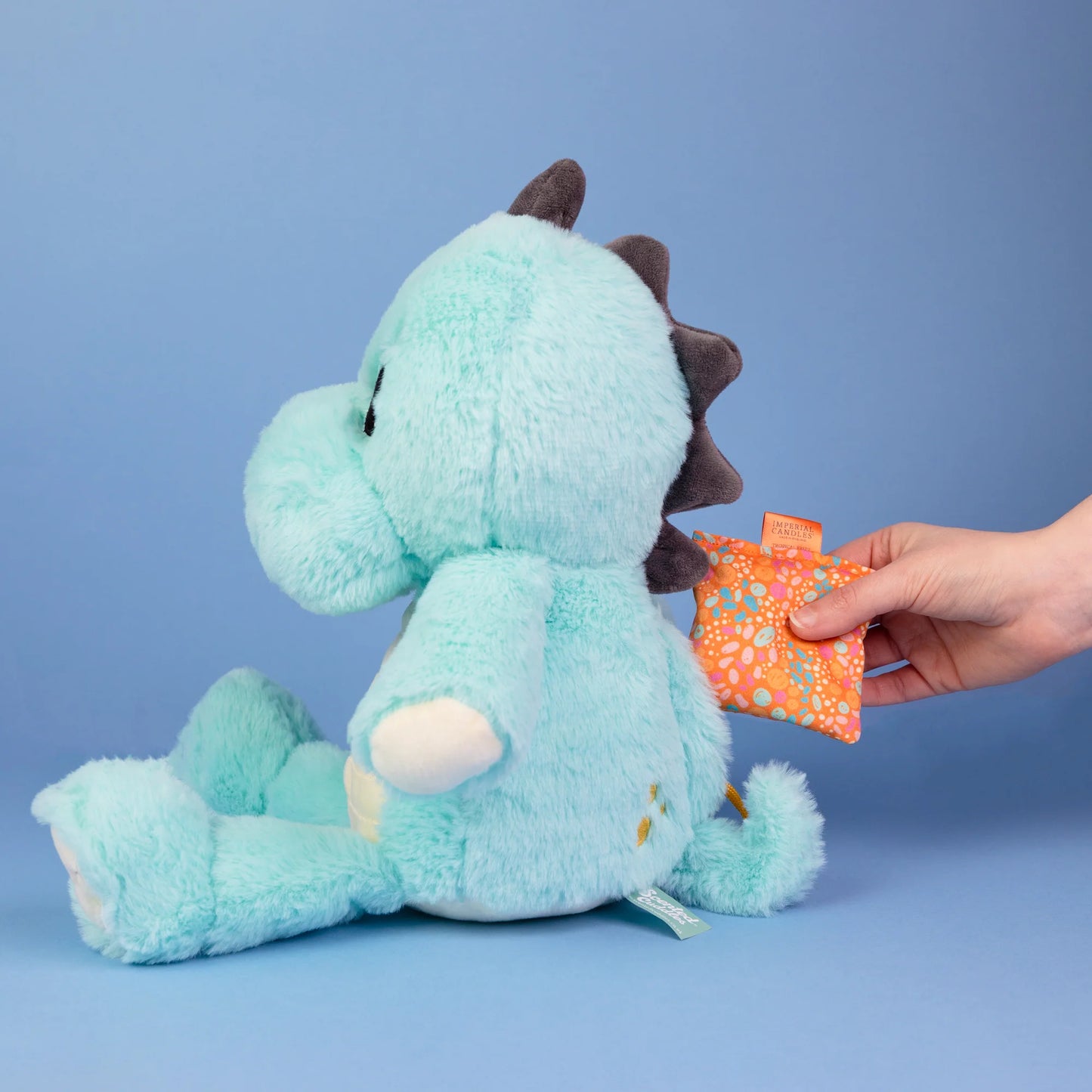 Cuddly dinosaur Juno from Imperial Candles - Juno - Scented Cuddles, ready for scented adventures with sachets.