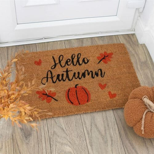 Natural Hello Autumn Doormat featuring 'Hello Autumn' text with a pumpkin and leaves, perfect for your entryway.