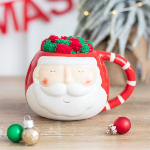 Santa Mug and Socks Set featuring a cheerful mug and fluffy socks, perfect for a cosy Christmas experience.
