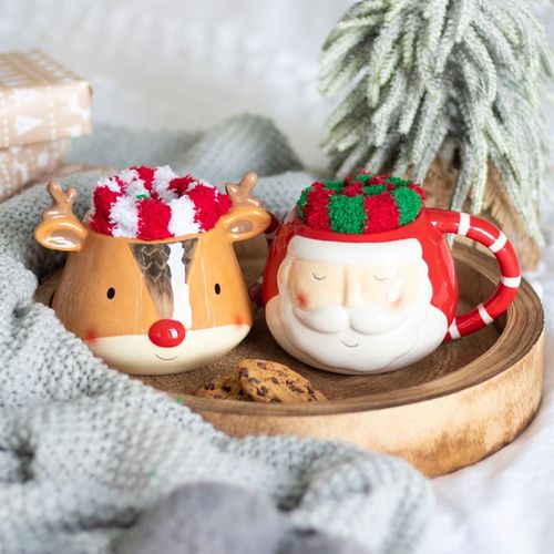 Enjoy festive warmth with the Reindeer Mug and Socks Set, featuring a charming reindeer mug and fluffy striped socks.