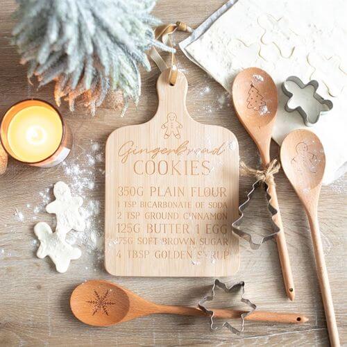 Gingerbread Cookies Bamboo Serving Board displays festive ingredients, perfect for serving Christmas treats in style.