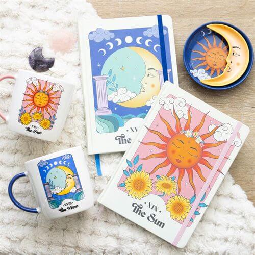 The Sun Celestial A5 Notebook showcases vibrant tarot-inspired designs, perfect for notes and sketches.